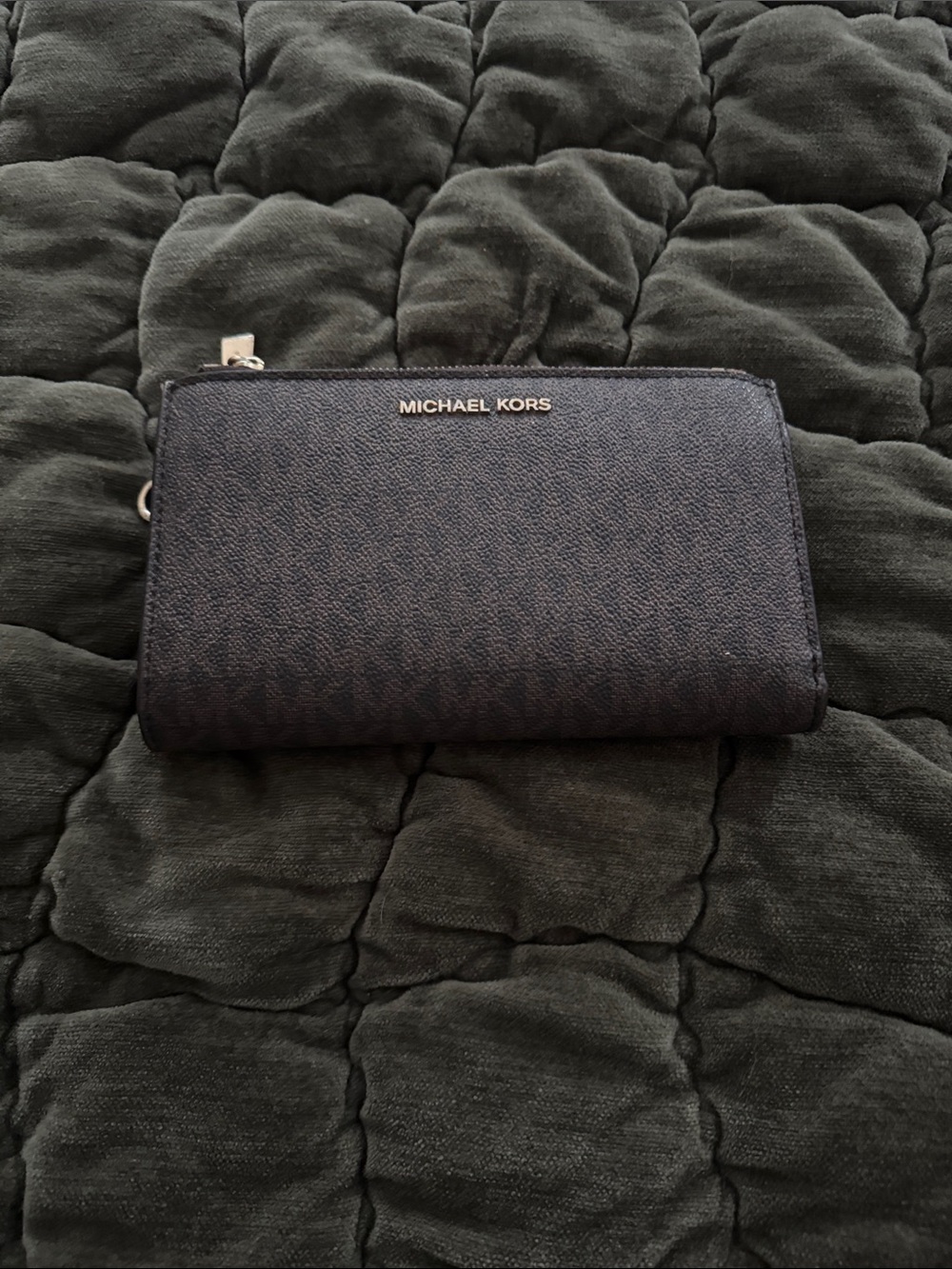 Michael Kor’s Women’s Brown Zip-Around Wallet with Gold Logo and phone holder.